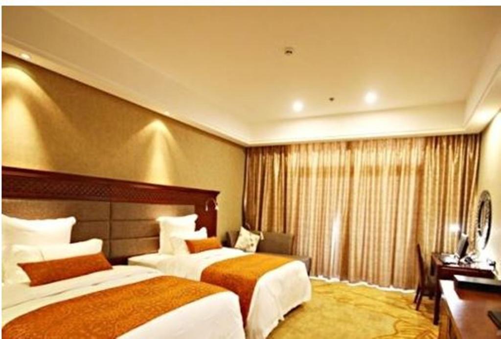 Hotel Ramada Plaza Xishuangbanna Exterior foto