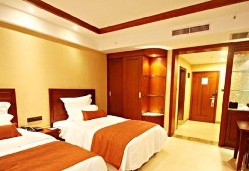 Hotel Ramada Plaza Xishuangbanna Exterior foto